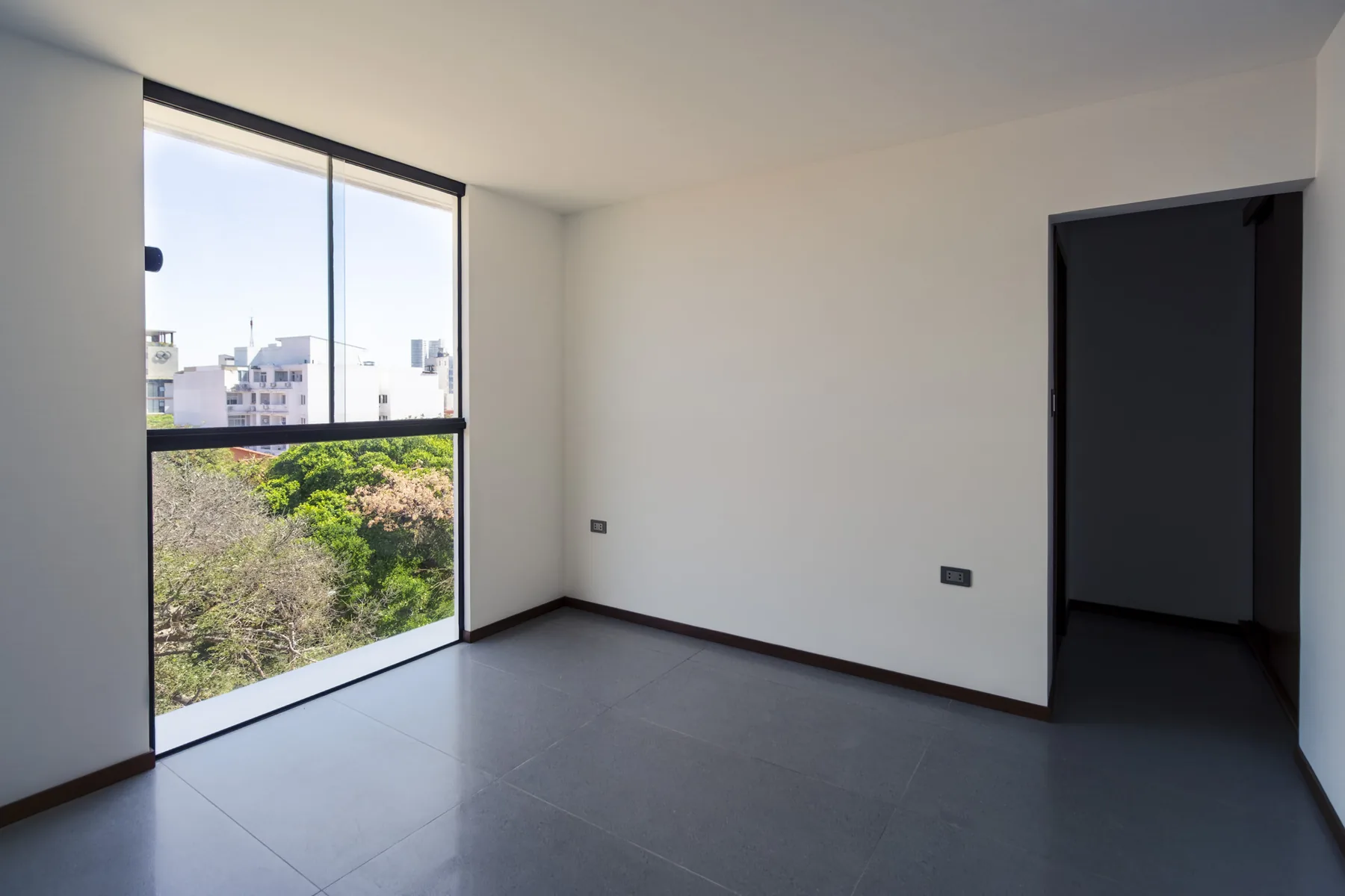 Dormitorio iluminado del departamento D22